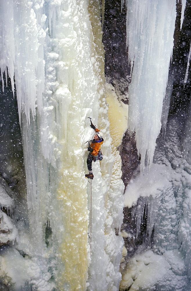 Kelly Cordes makes his way up a frozen waterfall using ice axes and crampons as well as balance and focus. The Ouray Ice Park is located in the Uncompahgre Gorge in Ouray Colorado. The Park is funded mostly by the Ouray Ice Festival that happens every Martin Luther King weekend and by the festivals corporate sponsers.