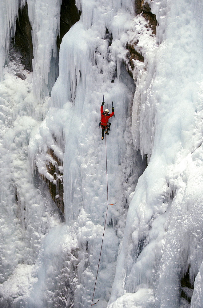 Steve Giddings makes his way up a frozen waterfall at the Ouray Ice Festival in Ouray, Colorado. Ice climbers require ice axes, crampons, rope and harness as well as a great deal of balance and focus. The Ouray Ice Festival is located in the Uncompahgre Gorge and is held once a year during  Martin Luther King weekend.