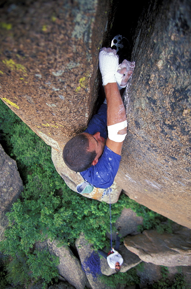 Justin Bastien places a cam in a crack on a 5.12 climbing route in the Vedauwoo climbing area in Medicine Bow National Forest, Wyoming. Vedauwoo is believed to mean "Land of the Earthborn Spirits" in Arapahoe.