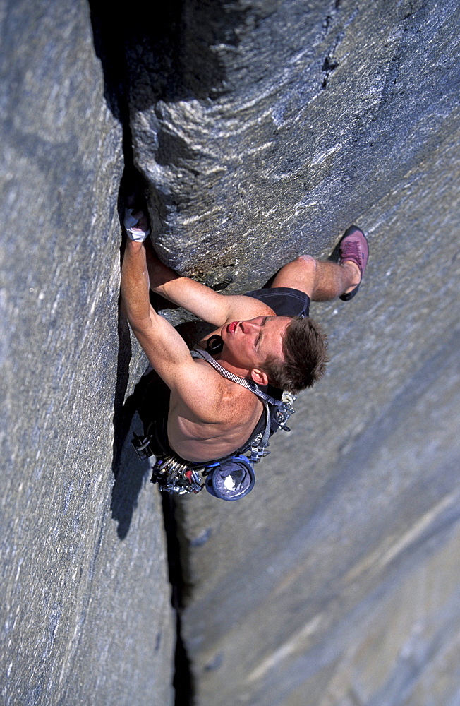 Rock climber Tommy Caldwell jams his hands into a crack on while lead climbing the the West Buttress climbing route of El Cap in Yosemite Valley, California.Tommy Caldwell is one of the world's leading big wall rock climbers.