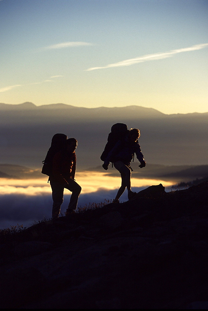 A Couple Hiking Above the Clouds in the Sierra Mountains of California