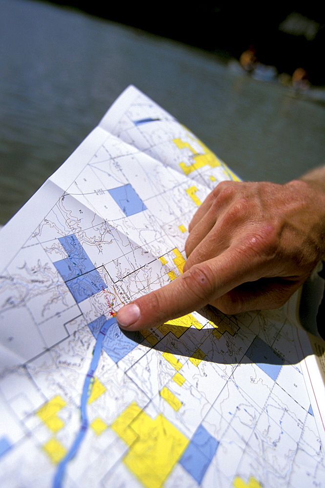 A Boy Scout troop leader points at the Lewis and Clark trail on the Upper Missouri River in Montana.