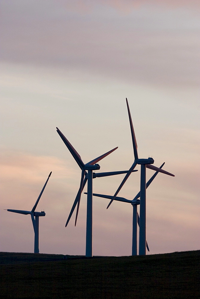 Windmills used to generate electrical power at Cowley Ridge in southern Alberta, Canada. (silhouette)