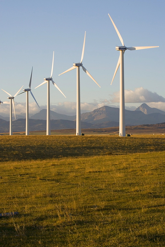 Windmills used for power generation at sunrise, near Pincher Creek, Alberta, Canada.