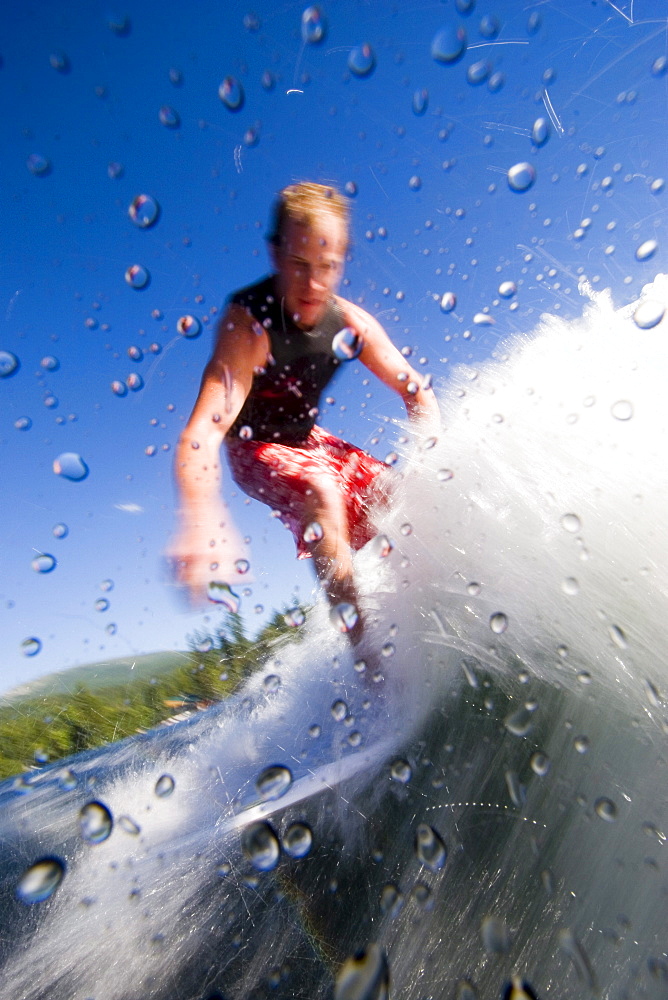 Man wake boarding on sunny day, Idaho