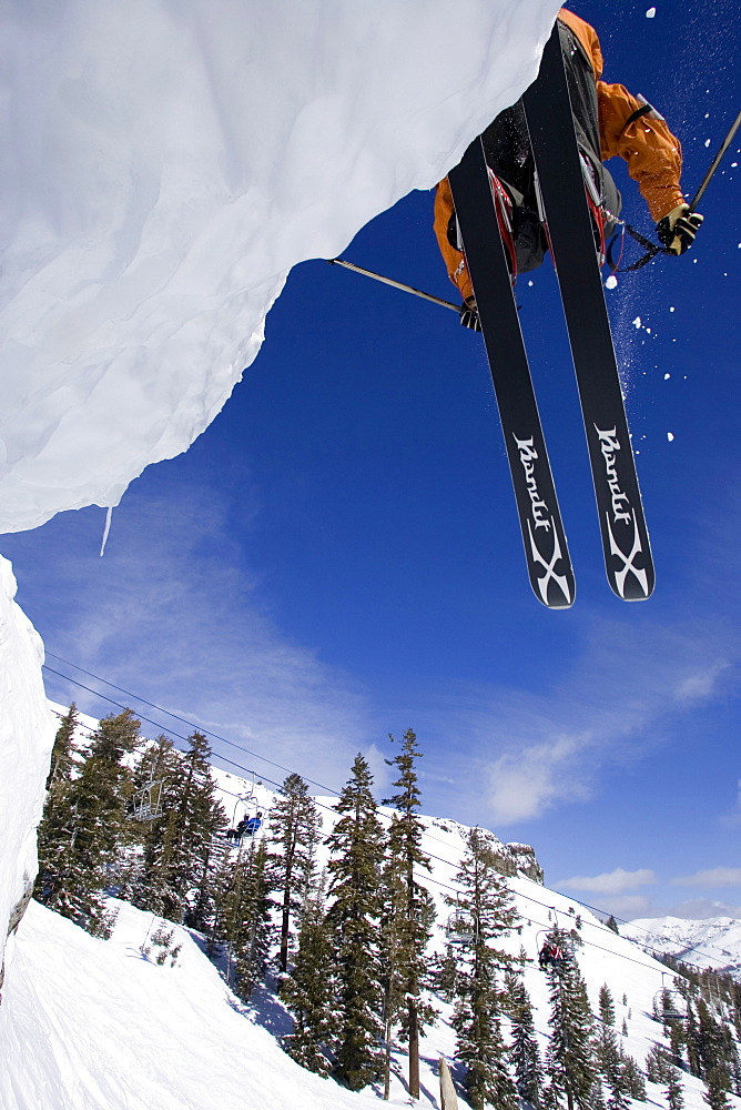 A skier jumps off of a cliff in Kirkwood, California.