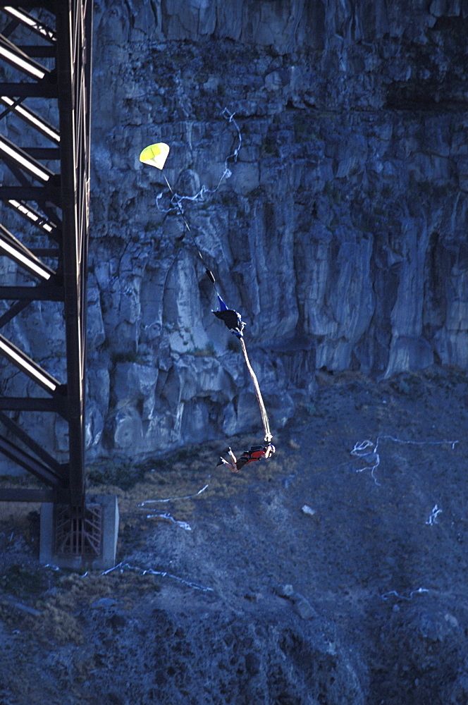 A BASE jumper opens his parachute after jumping off of a bridge in Twin Falls, Idaho.