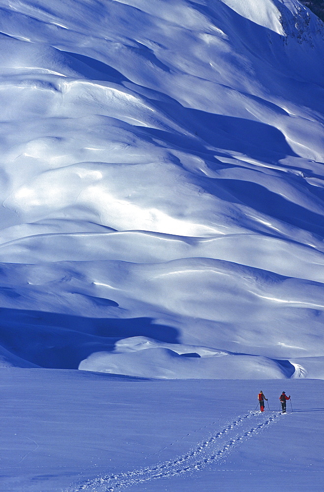 Two people with snow-shoes in the Brevent area, Mont Blanc massif