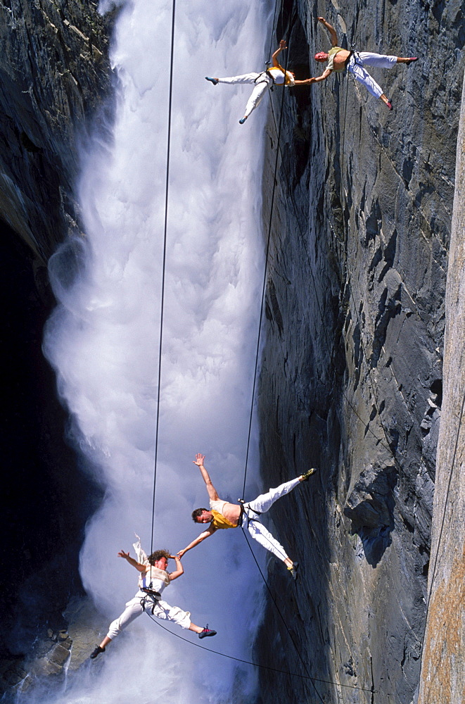 Suspended from wires 2,500 vertical feet up a cliffside in Yosemite National Park, the Bandaloop Troupe performs an air dance next to Yosemite Falls.