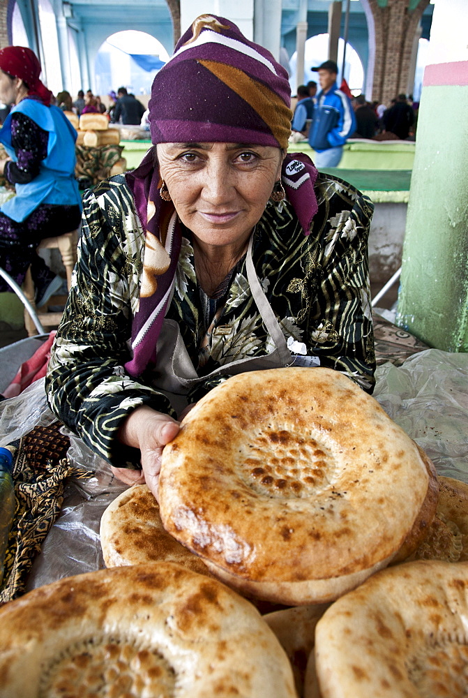 Traditional bread vendor in a market of  Samarkand, Uzbekistan