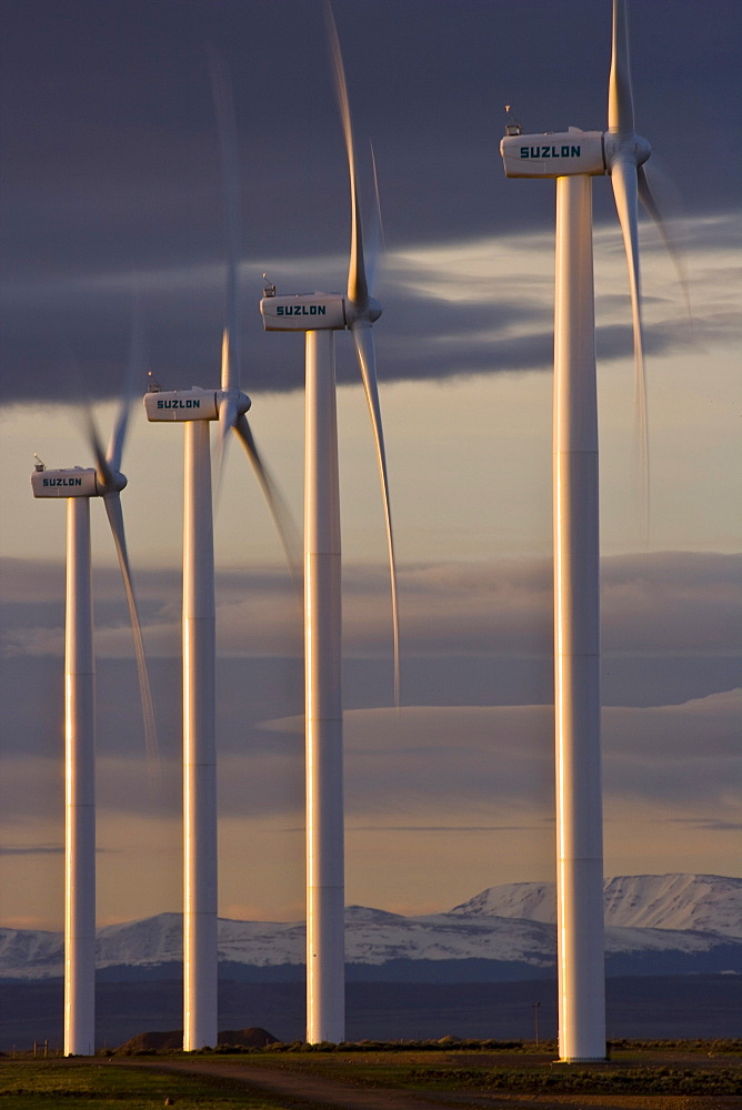 Wind turbines and the High Uinta Mountains at a wind farm in Southern Wyoming.