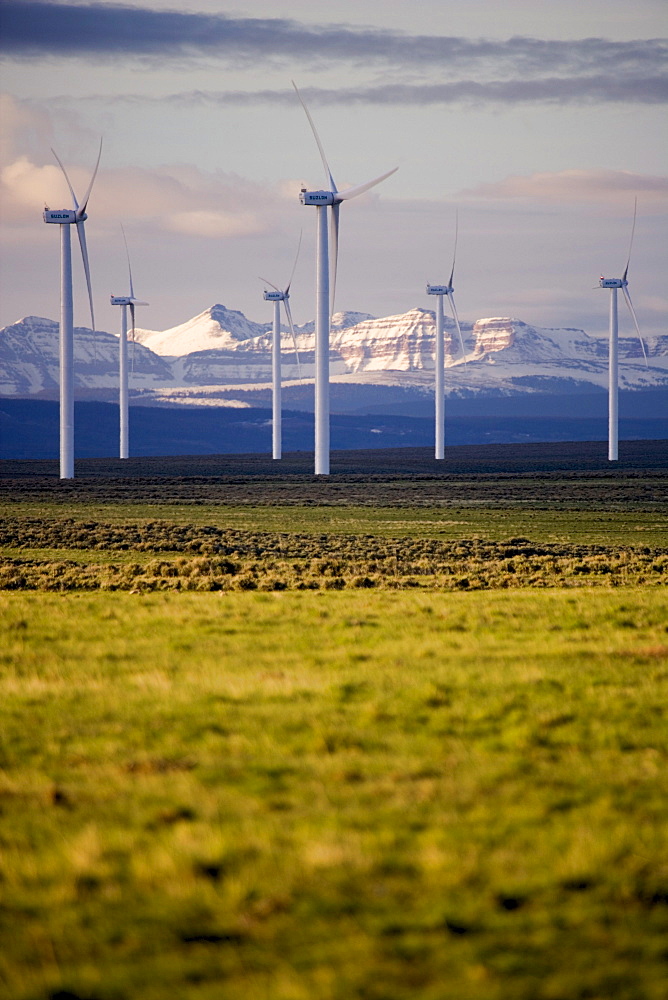 Wind turbines and the High Uinta Mountains at a wind farm in Southern Wyoming.