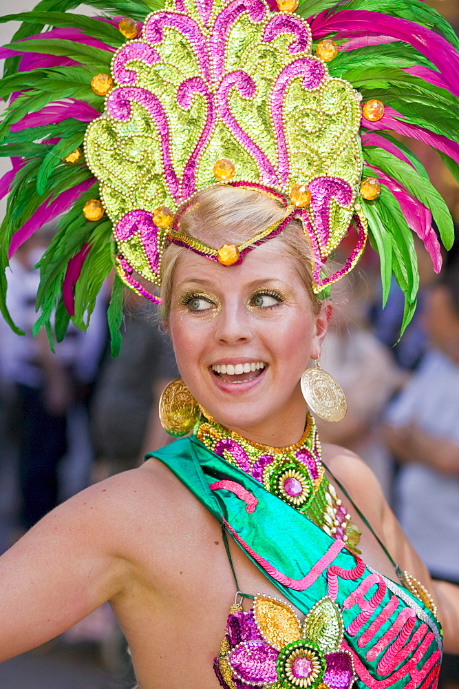 A dancer takes part in the parade of the Copenhagen Whitsun Carnival, Denmark.