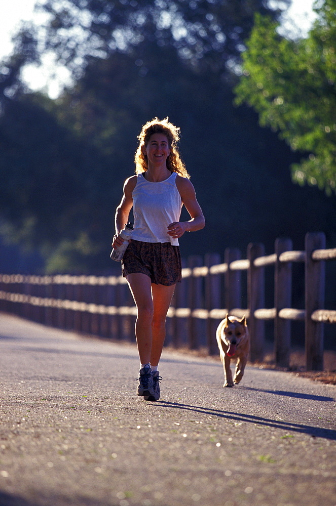 Lynne Siodmak and Evie run on the Ojai Valley Trail along the ocean in Ojai, California.