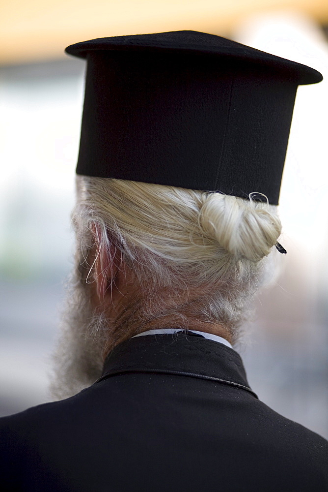 A rear portrait of a Greek Orthodox priest in Nafpaktos, Greece on October 6, 2007.