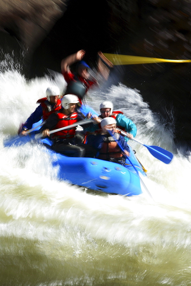 Motion-blur photo of unknown whitewater rafters crashing through Pillow Rock rapid on the Upper Gauley river near Fayetteville, WV