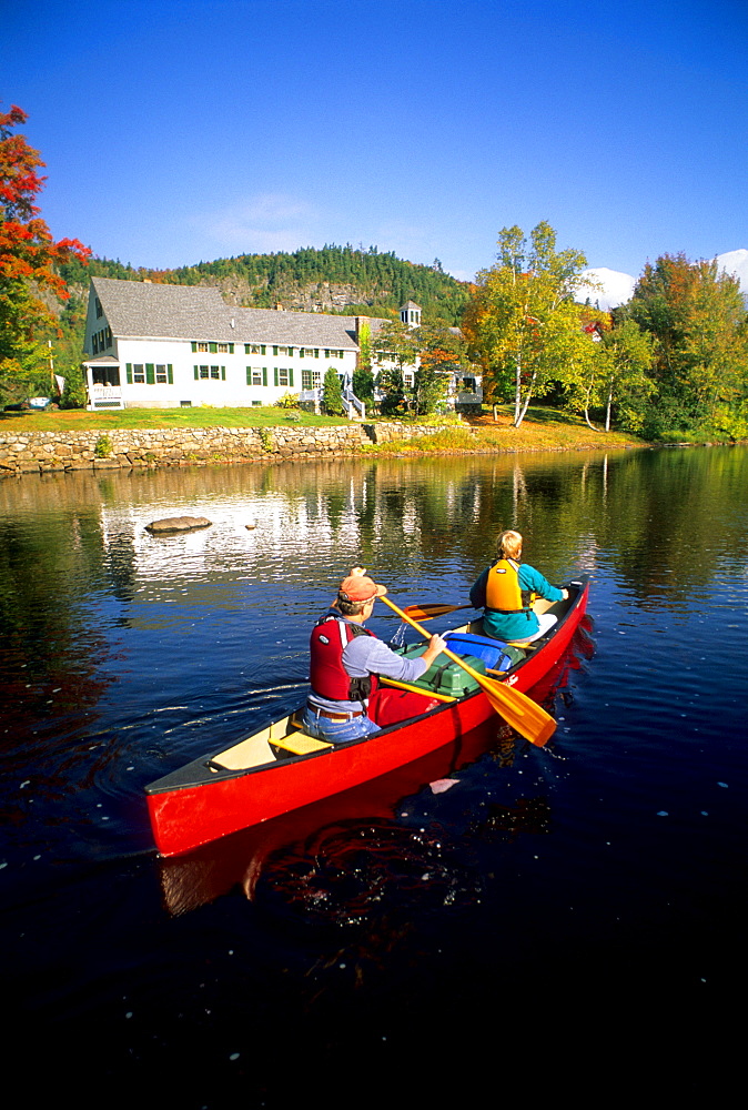 Rob Center and Kay Henry paddle their canoe on the Upper Ammonoosuc River in the village of Stark, in far northern New Hampshire. The river is a section of the Northern Forest canoe Trail, which was founded by Rob Center and Kay Henry.