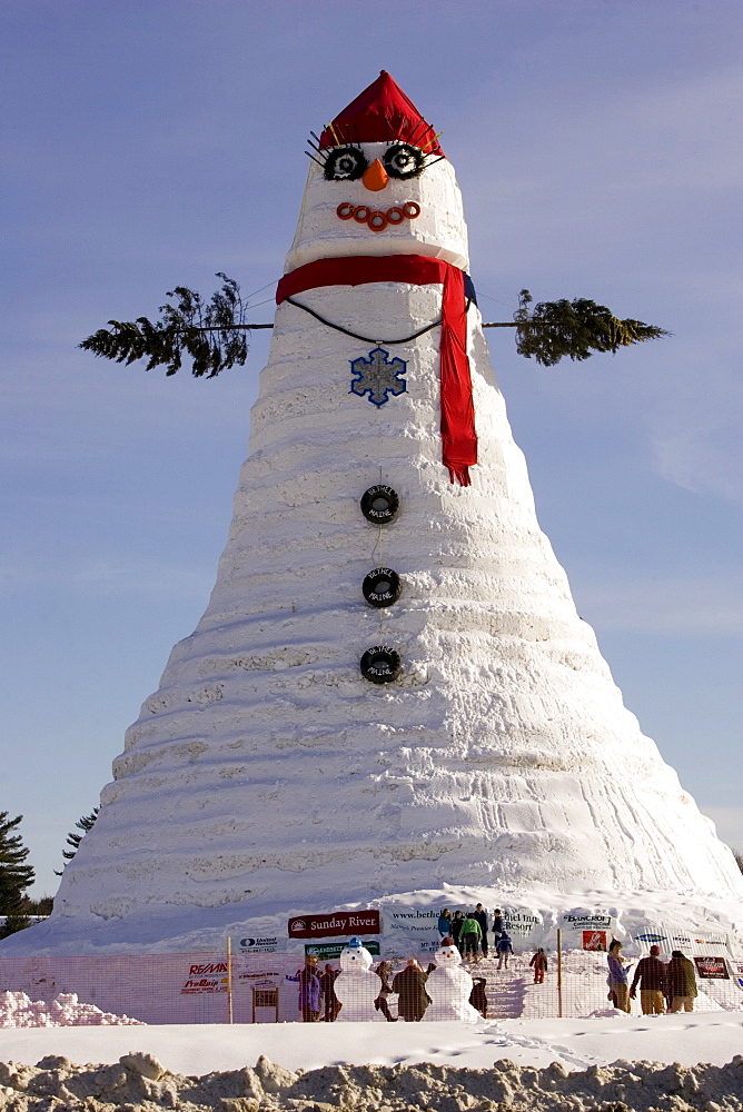 People view the world's tallest snowman, actually a snow woman named after US Senator Olympia Snowe. The Guinness Book of World Record snowman, built the winter of 2007-08, in Bethel Maine, measured 122 feet tall, and used an estimated 13 million pounds of snow.