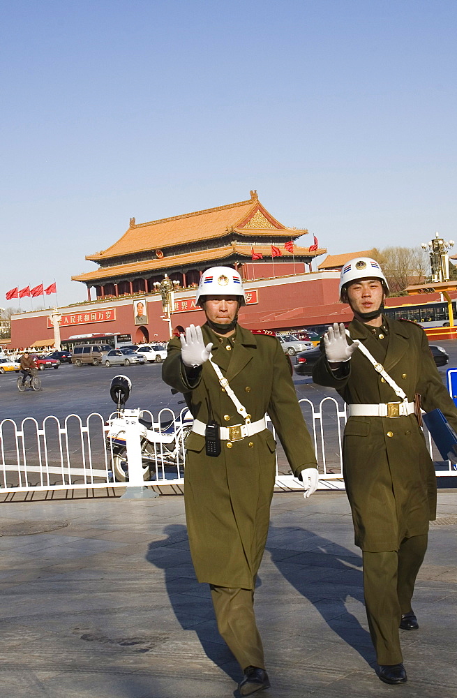 Para-military police hold up their hands to say stop near Tiananmen Gate in the center of Beijing, China.