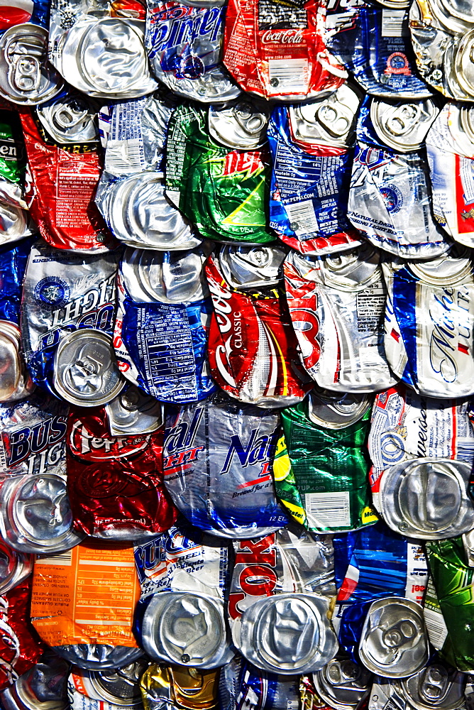 Flattened soft drink cans.