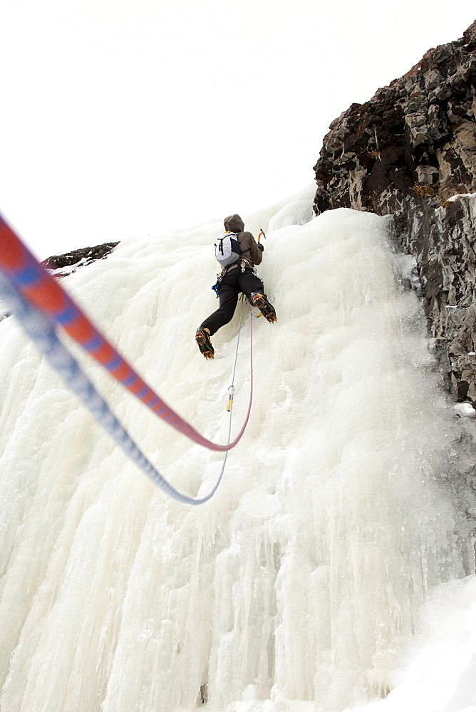 A man ice climbing.