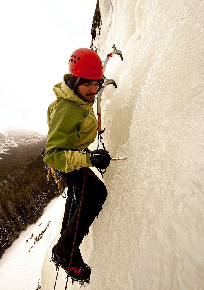 A man ice climbing.