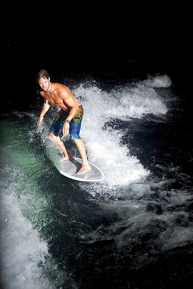 Male wakesurfing in Idaho.