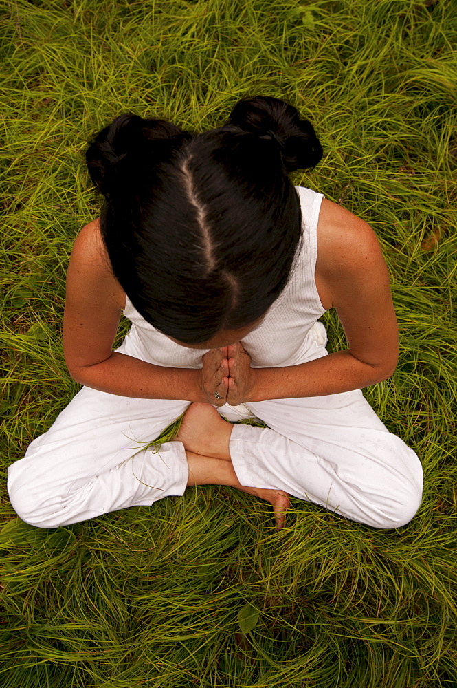 Woman in a yoga pose.