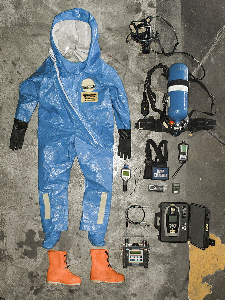 Nuclear radiation suit and accessories hangs on the wall.