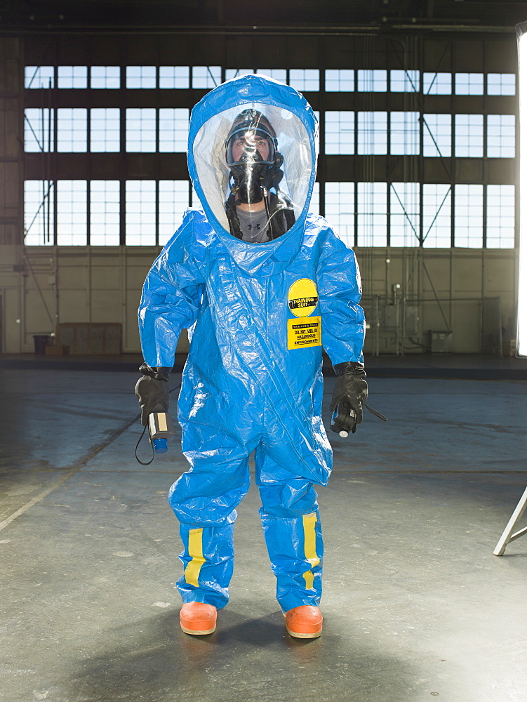 A National Guardsman wears a Nuclear radiation suit during training at an air base in South Dakota.