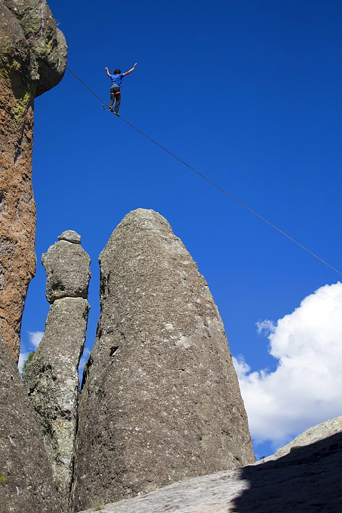 A man of France, walks on the slackline in Los Monjes valley near Creel, Chihuahua, Mexico