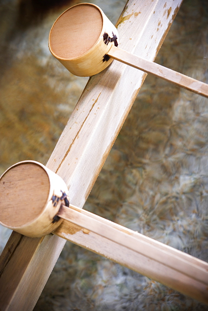 Wooden drinking cups at a water fountain, Japan.