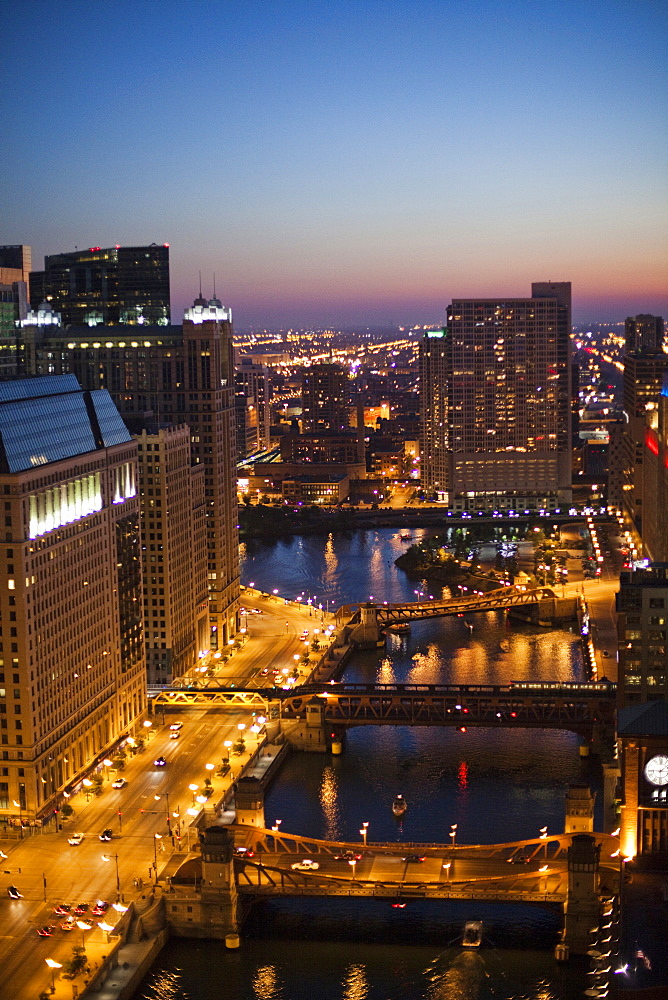 City lights glow at dusk on a clear evening, United States of America