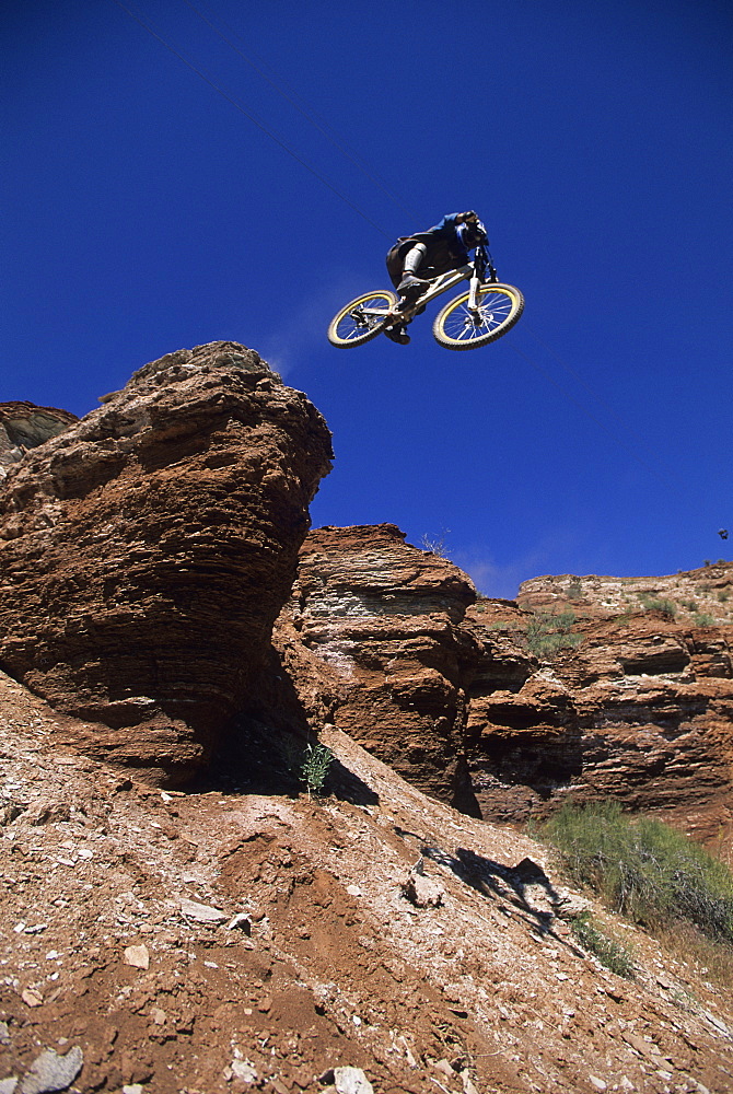 Wade Simmons dropping a cliff in Virgin, Utah, United States of America