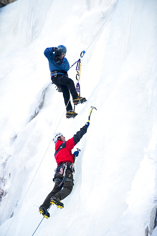 Corey Rich photographs Zach Fletcher while ice climbing in Lee Vining, CA, United States of America