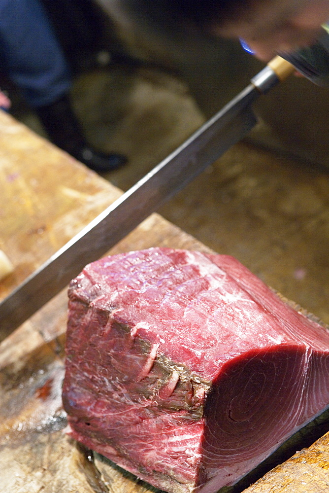 Close-up of fresh tuna being cut at fish market, Tokya, Japan, Japan