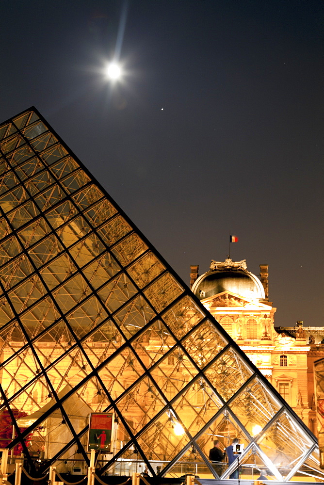 The Louvre Pyramid at night, Paris, France.