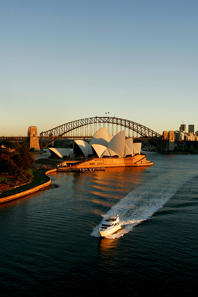 Motor yacht in the bay of Sydney during sunrise.