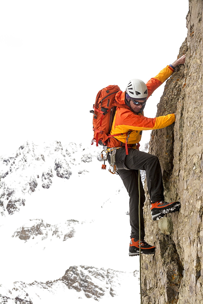 A man climbing Lizard Head Peak, Telluride, Colorado.