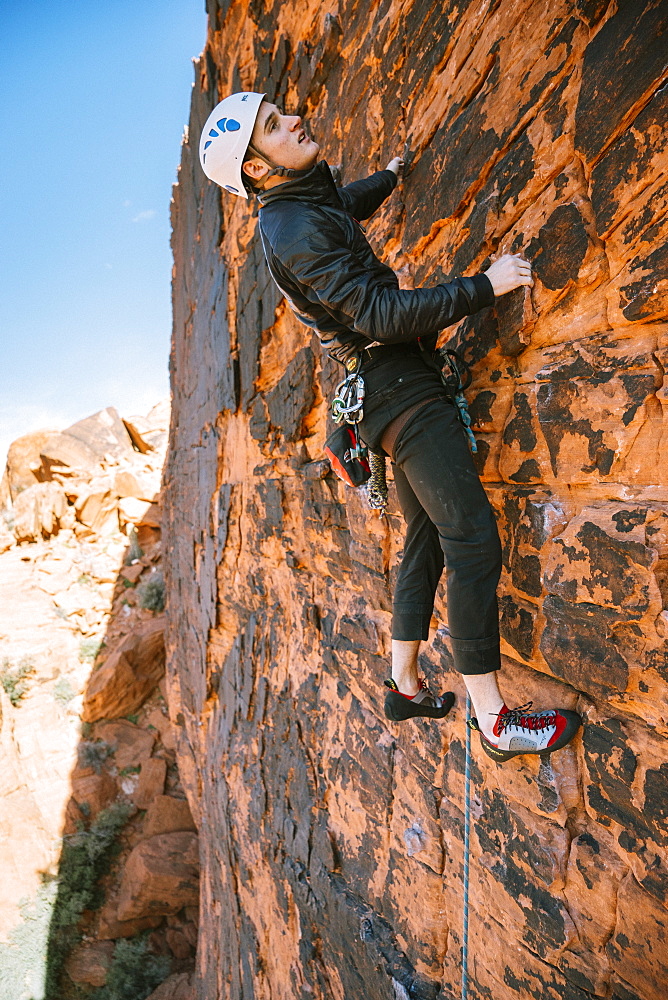 A climber leading "Brief Encounter" (5.8) on Panty Wall in Red Rock Canyon, Nevada