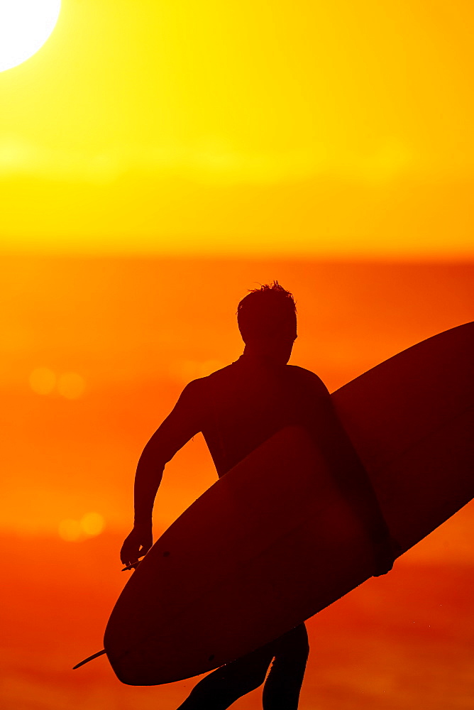 Close-up Of A Male With Surfboard At Sunset