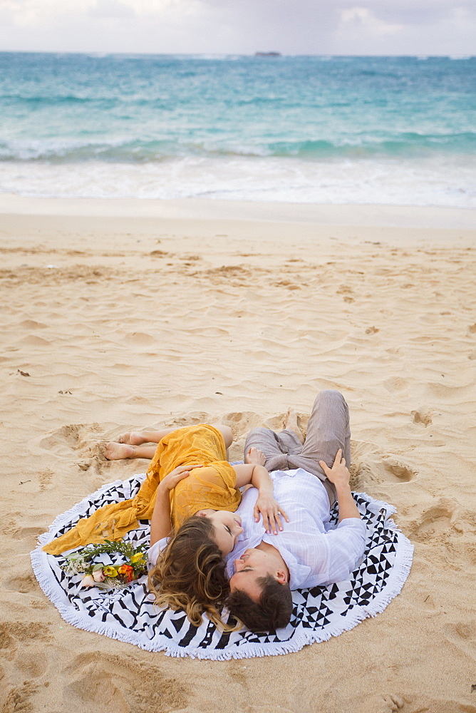 Engaged couple portrait on the beach at North Shore Oahu Hawaii in the Spring.