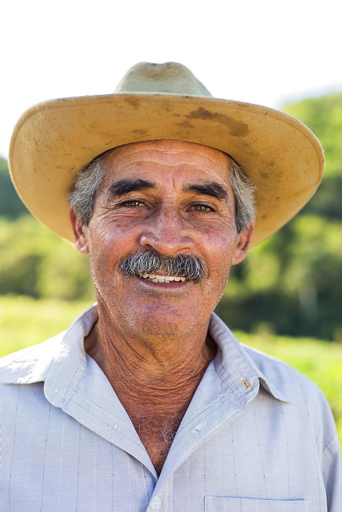 Headshot portrait of smiling farmer in hat, Vinales, Pinar del Rio Province, Cuba