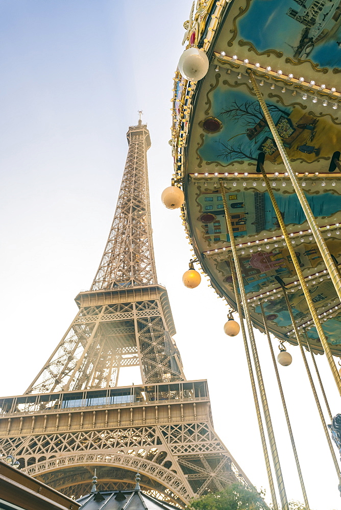 View of the famous Eiffel Tower and carousel in the foreground, Paris, France