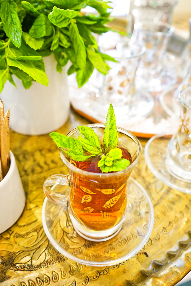 Close-up of glass of traditional tea with mint leaves, Madaba Governorate, Jordan