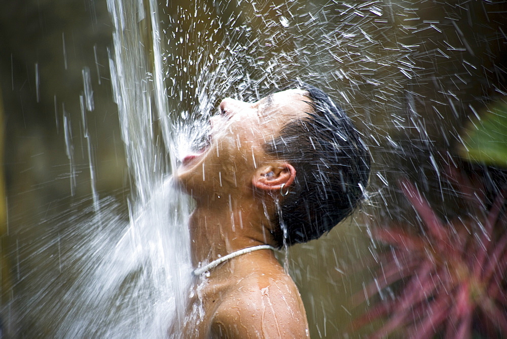 Man Under Waterfall