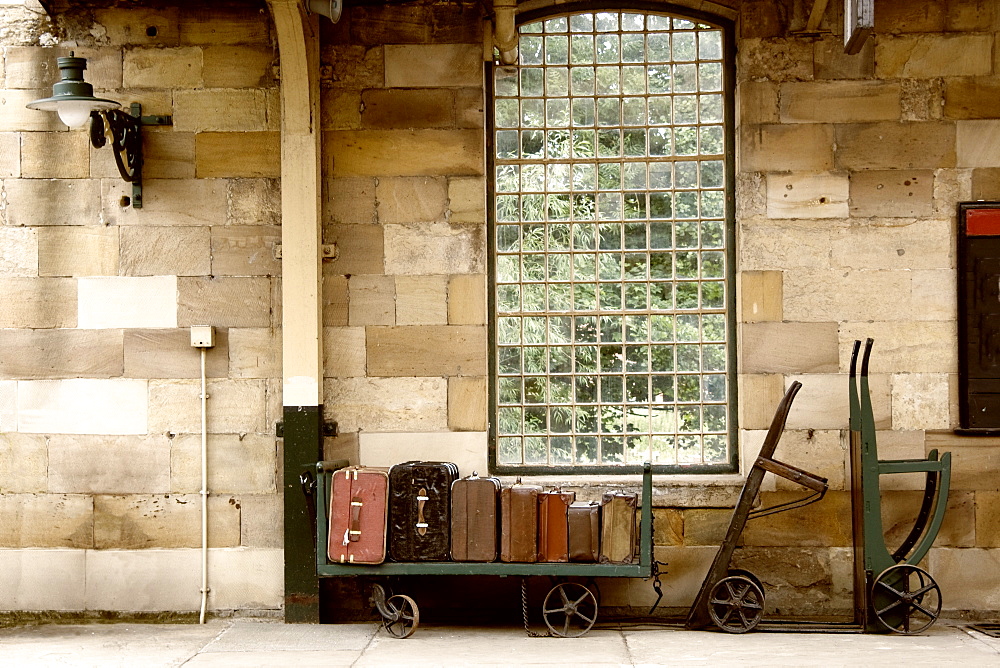 Suitcases On A Luggage Trolley In A Train Station