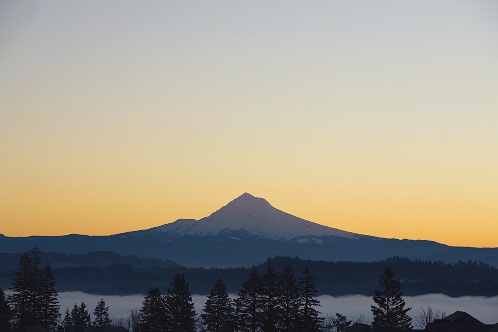 Silhouette Of Mountain Peak At Sunrise