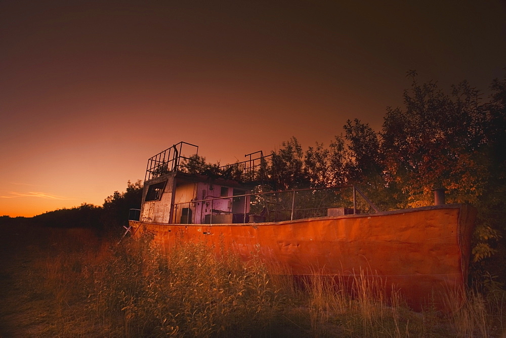 Inuvik, Northwest Territories, Canada, An Abandoned Ship On The Riverbank