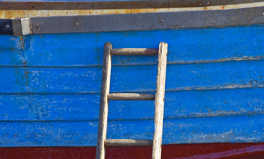 Craster, Northumberland, England, A Wooden Ladder Propped Against The Side Of A Boat